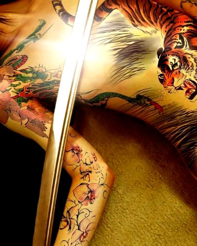 Hot Asian Girl With A Katana Across Her Boobs And Great Ink!